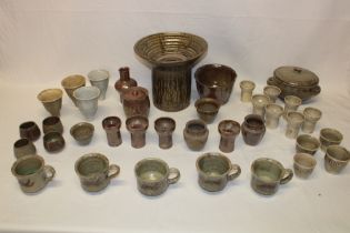 A selection of various Cornish studio pottery including mugs, small vases, two-piece table centre,