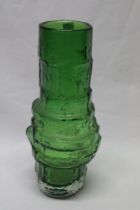 A Whitefriars green tinted glass cylindrical vase with raised decoration,