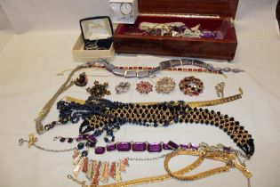 A selection of various costume jewellery including brooches, necklaces etc.