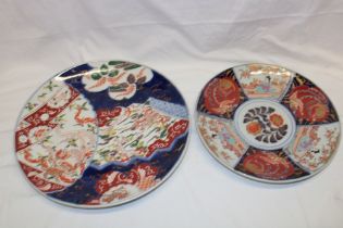 A 19th century Japanese Imari pottery circular charger with painted floral decoration,