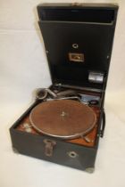 An HMV portable gramophone with chromium plated mounts in black fibre case