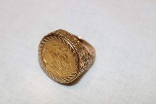 A 9ct gold signet ring mounted with an Edward VII 1909 gold sovereign (16.