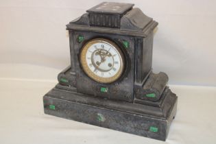 A 19th century mantel clock with part visible escapement in malachite and black slate case (af)