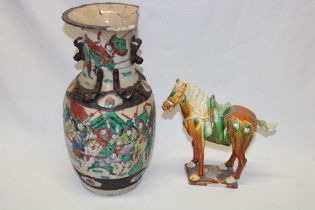 An Eastern pottery figure of a Tang-style horse and a Japanese Satsuma pottery tapered vase with