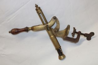 A large brass counter-top wine bottle corker "The Swift" with turned wood handle,