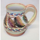 A Denby studio pottery tankard with painted leaf and geometric decoration