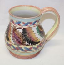 A Denby studio pottery tankard with painted leaf and geometric decoration
