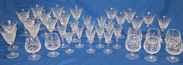 A part suite of Waterford crystal including eleven stemmed wine glasses, six smaller wine glasses,