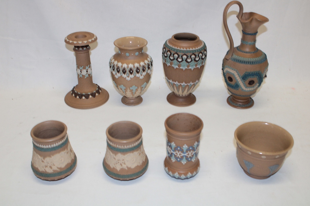 A selection of Doulton silicon pottery including tapered ewer, two similar tapered vases,