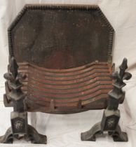 A good quality iron rectangular fire basket supported by two iron fire dogs together with a