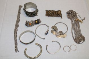 A selection of various silver costume jewellery, coin mounted bangle,