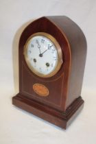 An Edwardian mantel clock with enamelled circular dial in inlaid mahogany gothic arched case