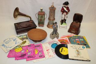 A selection of various novelty musical items including 1929 oak musical table barrel,