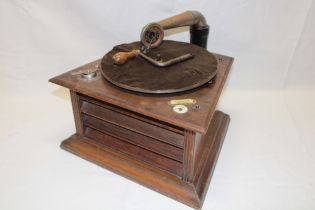 An early oak cased table top gramophone by Perfecta "The Perophone" with retail label for Tickell's