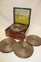A Victorian polyphon with a selection of 9" polyphon discs in brass mounted walnut rectangular case