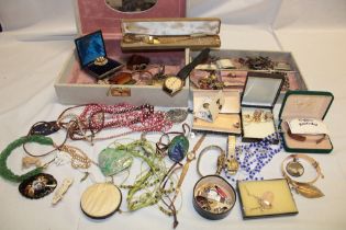 A selection of various costume jewellery including necklaces, brooches, dress rings,