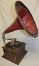 An old HMV oak table top gramophone with original painted metal horn