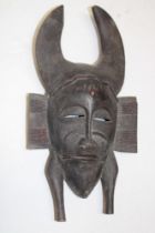 An old African carved wood mask,