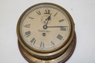 A ship's bulk head style clock by Henry Browne and Son Limited, Barking,