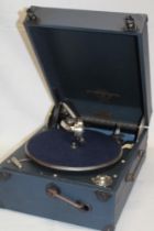 An old portable gramophone by Columbia in blue fibre case