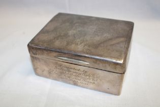 A George V silver rectangular cigarette box with engraved presentation text,