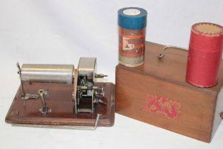 An unusual French clockwork portable phonograph with cockerel trade mark in walnut case with