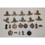 A selection of various military Corps cap badges including REME, Royal Army Catering Corps,
