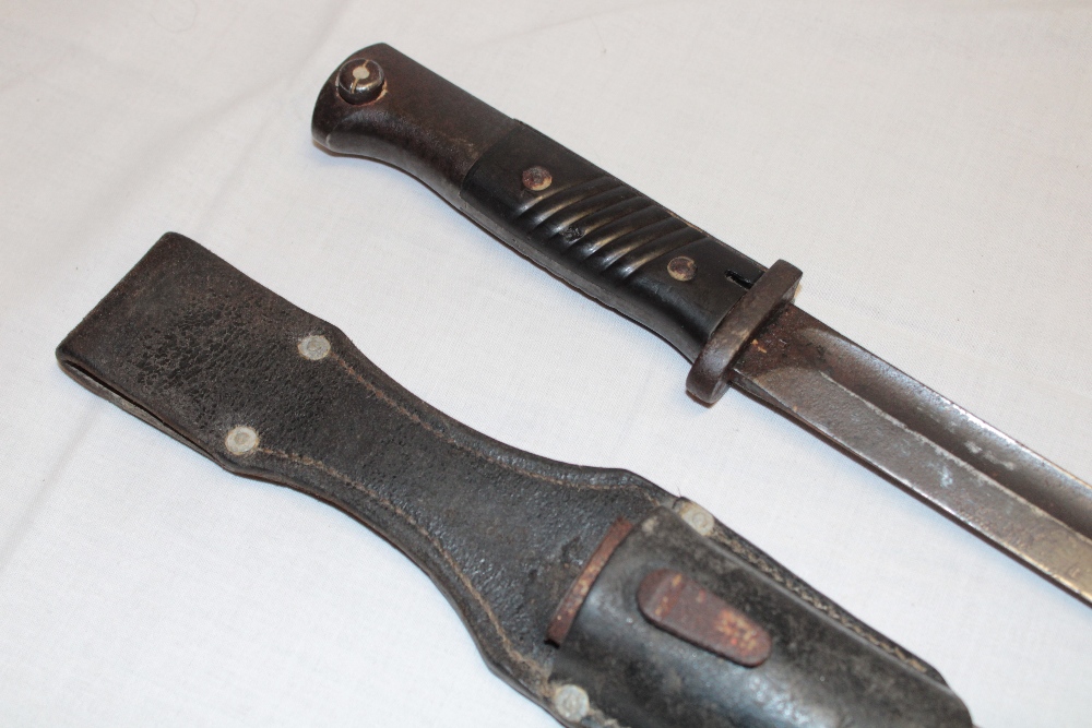 A Second War German Mauser bayonet with single edged blade in steel scabbard with leather frog (af) - Image 2 of 2