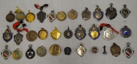 A collection of approximately 30 various cycling medals,