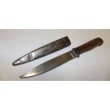 A First War German fighting knife with 6" single edged blade and plain wood grips in steel scabbard