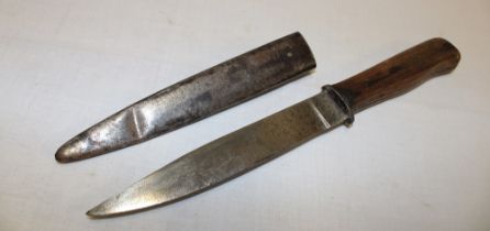 A First War German fighting knife with 6" single edged blade and plain wood grips in steel scabbard