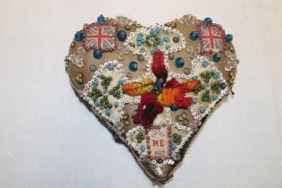 A First War soldier's valentine heart pincushion decorated with beads and Union Jack panels