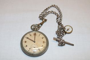 A nickel-plated military services pocket watch marked "G.S.T.P.