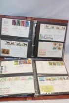 Two albums containing a collection of GB first day covers,