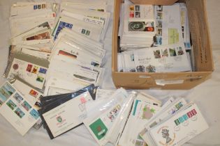 A box containing a large selection of GB and Channel Islands first day covers 1940's onwards