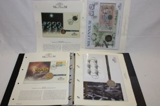 An album containing a collection of millennium coins and bank note covers including 1999 Guernsey