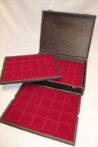 A Lindner collector's coin case containing four fitted trays