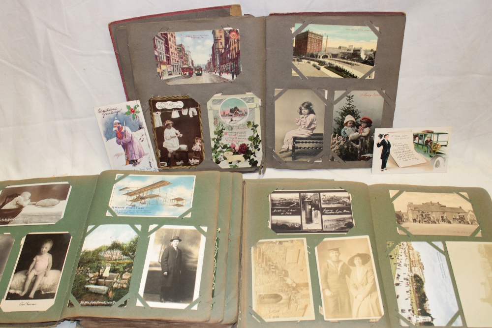 Three albums containing a selection of mixed black and white and coloured postcards including some - Image 2 of 2