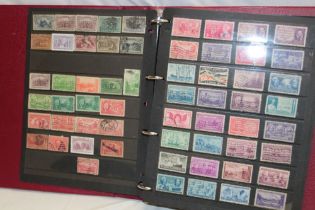 A folder album containing a collection of USA stamps,