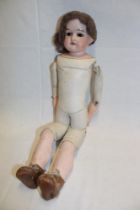 An old German porcelain headed doll marked "Cbr.