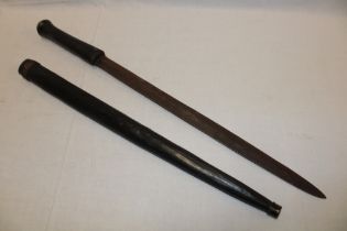 An African tribal sword with 20½" double-edged steel blade with stained wood hilt and scabbard