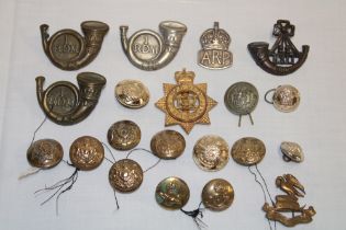 A selection of various military badges and insignia including King's Shropshire Light Infantry