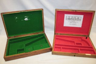 Two brass mounted oak cases adapted as a pistol case with baize lined fitted interiors,