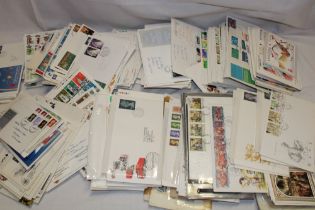 A box containing a large selection of GB first day covers,