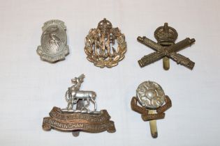 Five various First War military cap badges including 1st Birmingham Battalion Royal Warwickshire