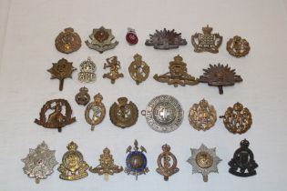 Various military cap badges including New Zealand R.A.F.