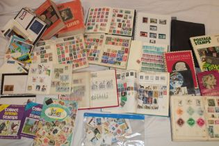 Two boxes containing various albums of mixed GB and World stamps, various packets of stamps,