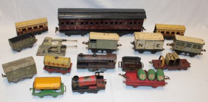 A Marklin gauge 1 tin-plate coach (minus wheels) and a selection of various 0 gauge locomotives,