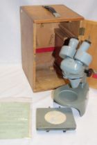 A Watson Barnet stereomicroscope with accessories,