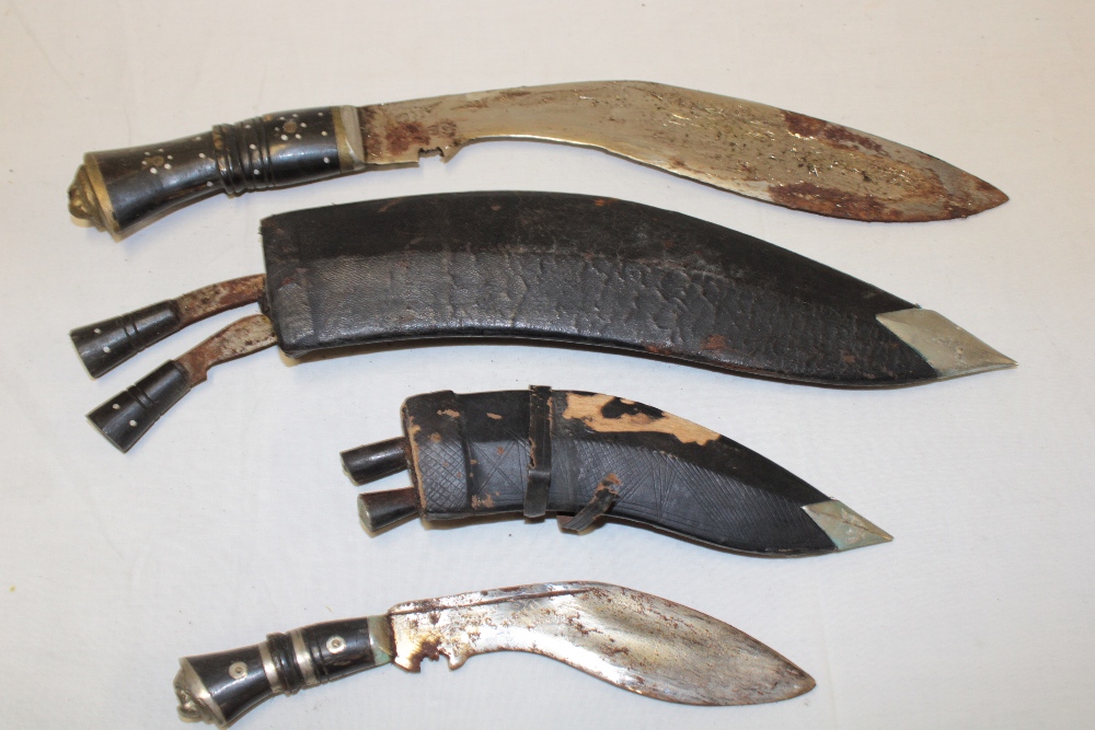 A Gurkha kukri in leather sheath and one other smaller kukri (2)